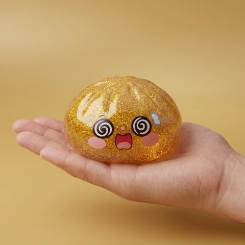 Gold Dumpling Squishy Lycka i handen, verklig storlek