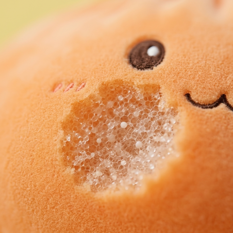 Giant Dumpling Squishy Orange – Mjuk Plyschdumpling — närbild på strukturen