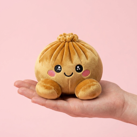 Squishy Dumpling Guld Royal i handen, verklig storlek