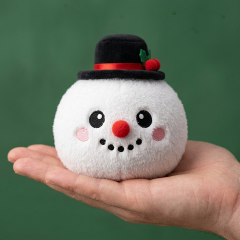 Squishy Dumpling Snögubbe Topphatt i handen, verklig storlek