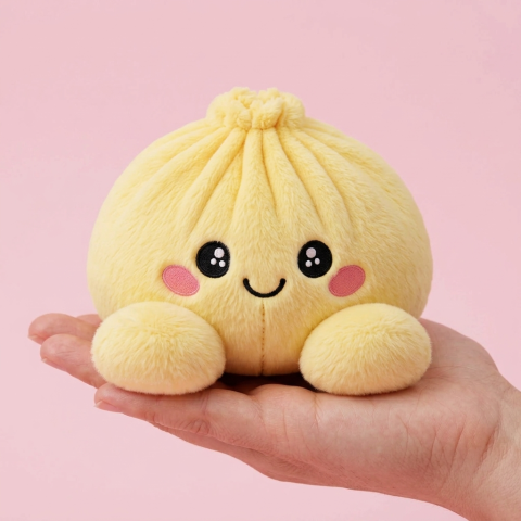 Dumpling Squishy Citrongul i handen, verklig storlek